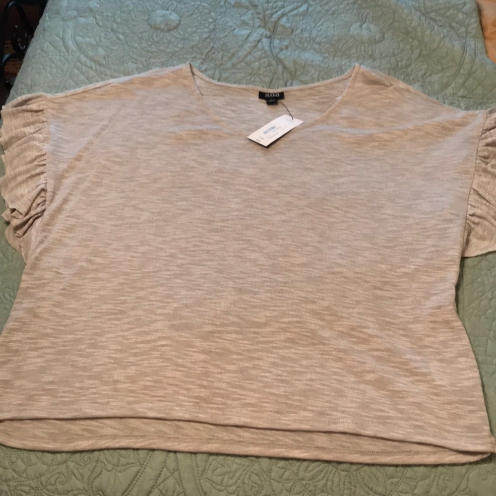 Cute comfy top.  Never worn. Ruffle sleeves